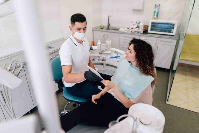 Dentist and patient discussing Digital Smile Design in a dental office